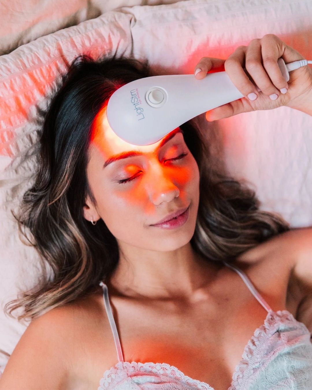 Girl using LightStim on her face
